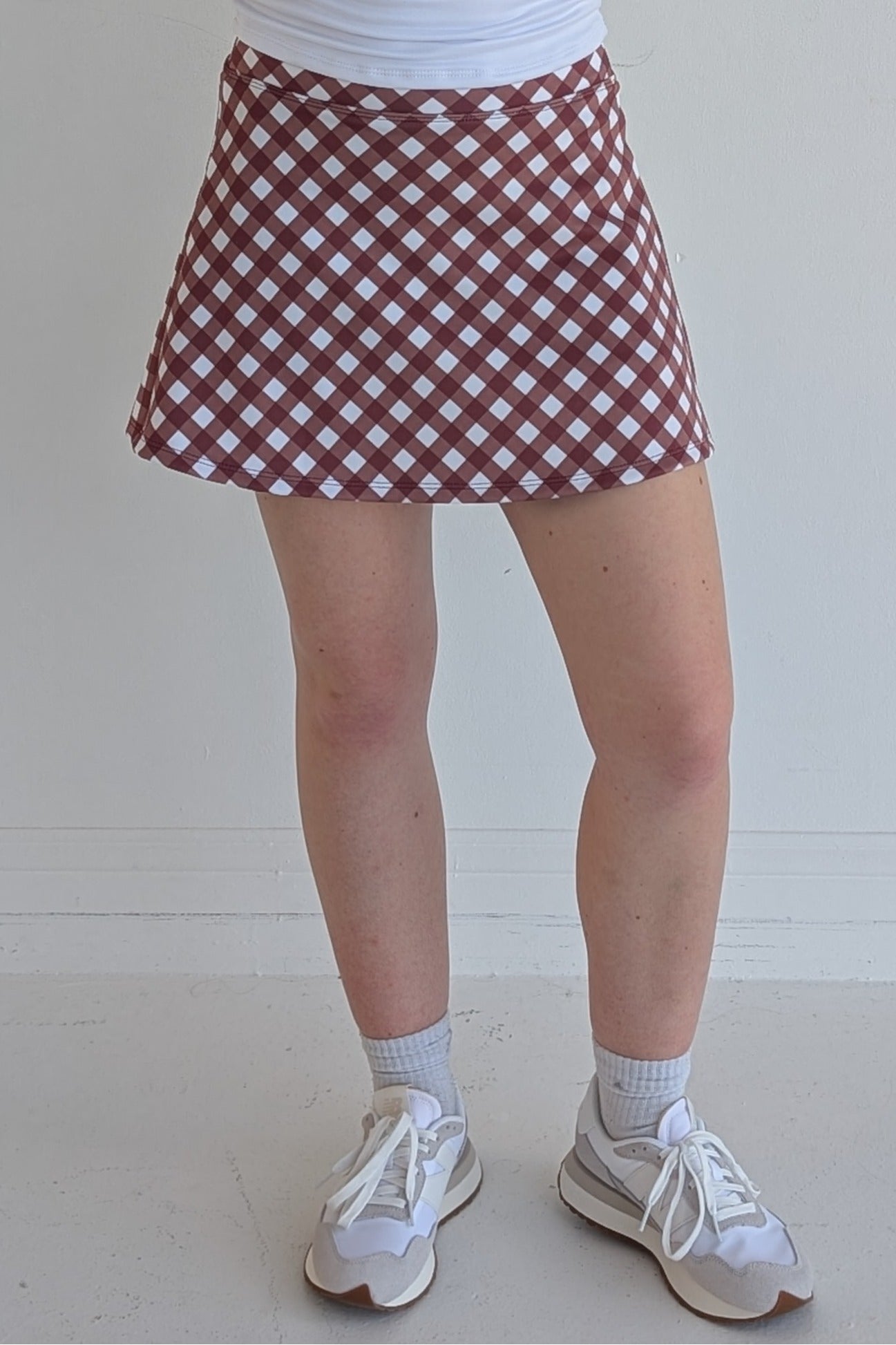 Relaxed back maroon gingham miniskirt with  built in shorts and pockets; great for gameday or hanging out with friends.