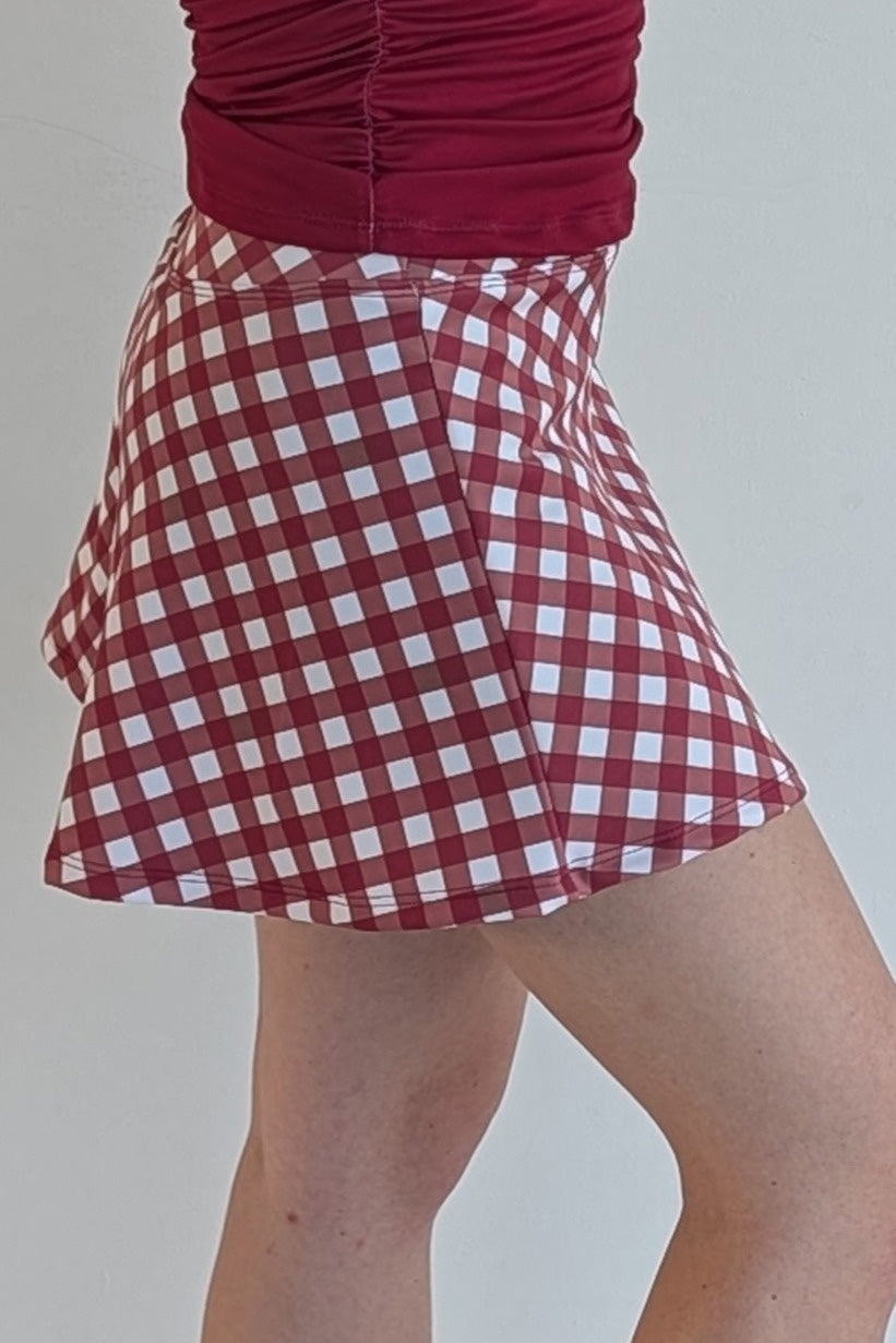 Relaxed back crimson gingham miniskirt with  built in shorts and pockets; great for gameday or hanging out with friends.