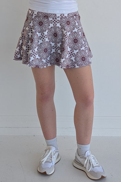 Full bodied maroon miniskirt with scroll print and built in shorts and pockets; great for gameday or hanging out with friends.