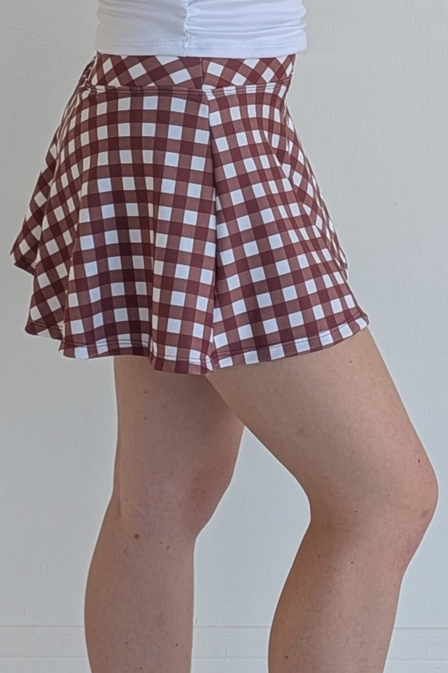 Full bodied maroon gingham miniskirt with  built in shorts and pockets; great for gameday or hanging out with friends.
