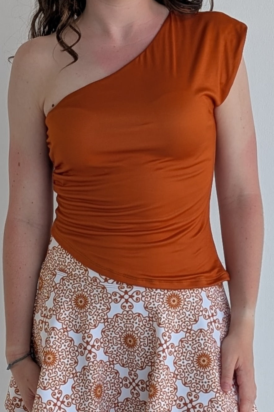 Asymmetric burnt orange single shoulder fully lined top; great for gameday or hanging out with friends.