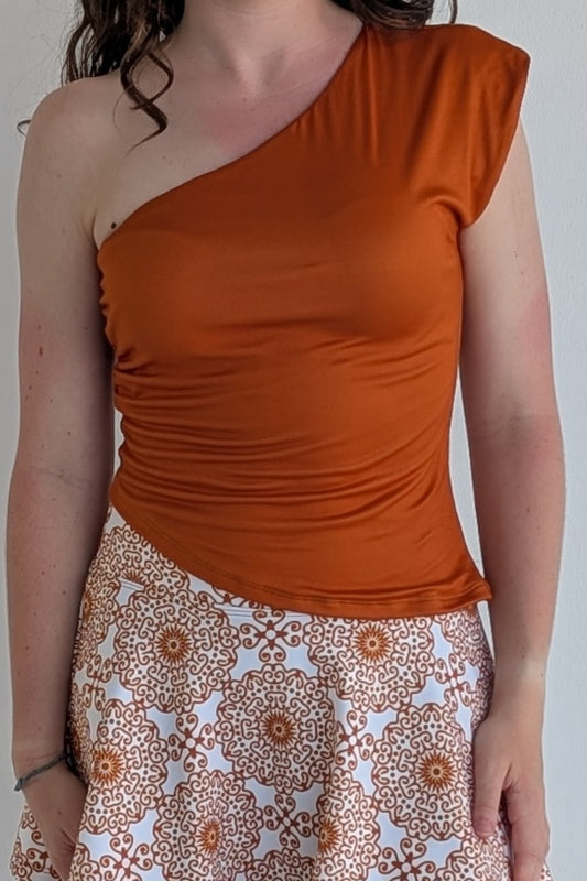 Asymmetric burnt orange single shoulder fully lined top; great for gameday or hanging out with friends.