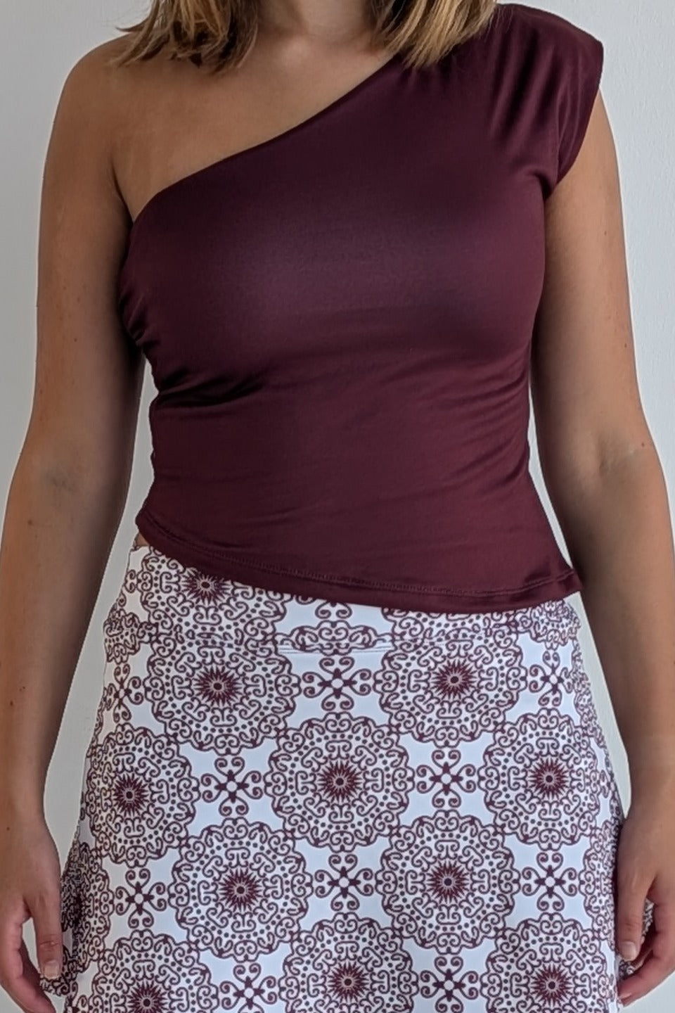 Asymmetric maroon single shoulder fully lined top; great for gameday or hanging out with friends.