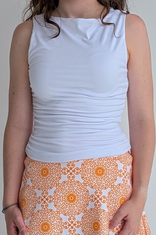 Boat neck white sleeveless fully lined top; great for gameday or hanging out with friends.