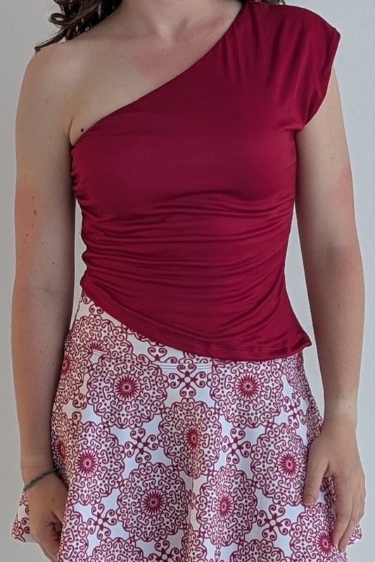 Asymmetric crimson single shoulder fully lined top; great for gameday or hanging out with friends.
