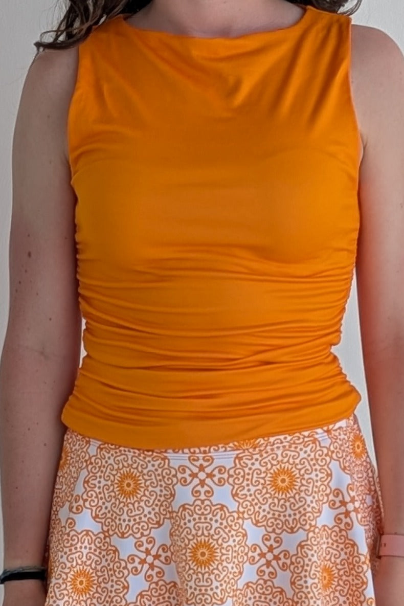 Boat neck orange sleeveless fully lined top; great for gameday or hanging out with friends.