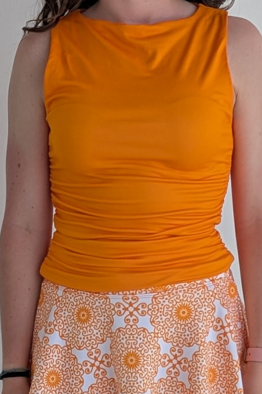 Boat neck orange sleeveless fully lined top; great for gameday or hanging out with friends.