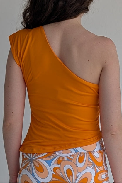 Asymmetric orange single shoulder fully lined top; great for gameday or hanging out with friends.